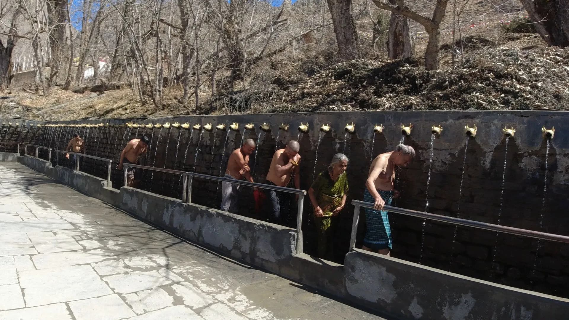 Pilgrims at the 108 Mukti Dhara water spouts